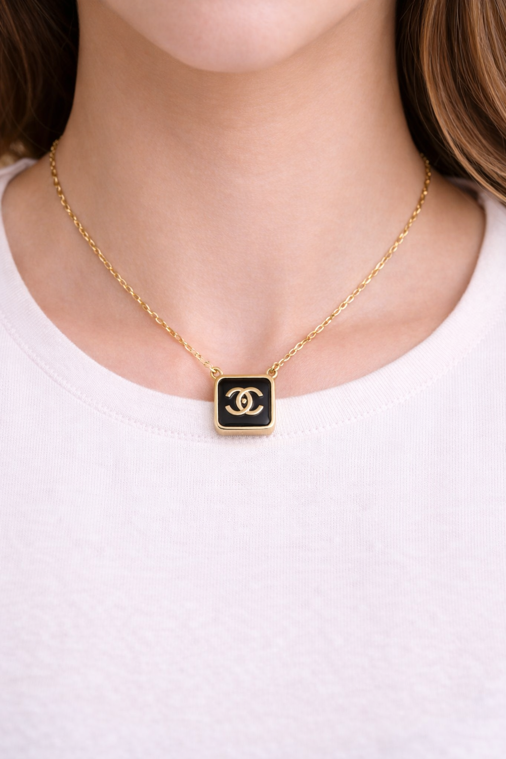 Black square pendant necklace with gold-tone chain